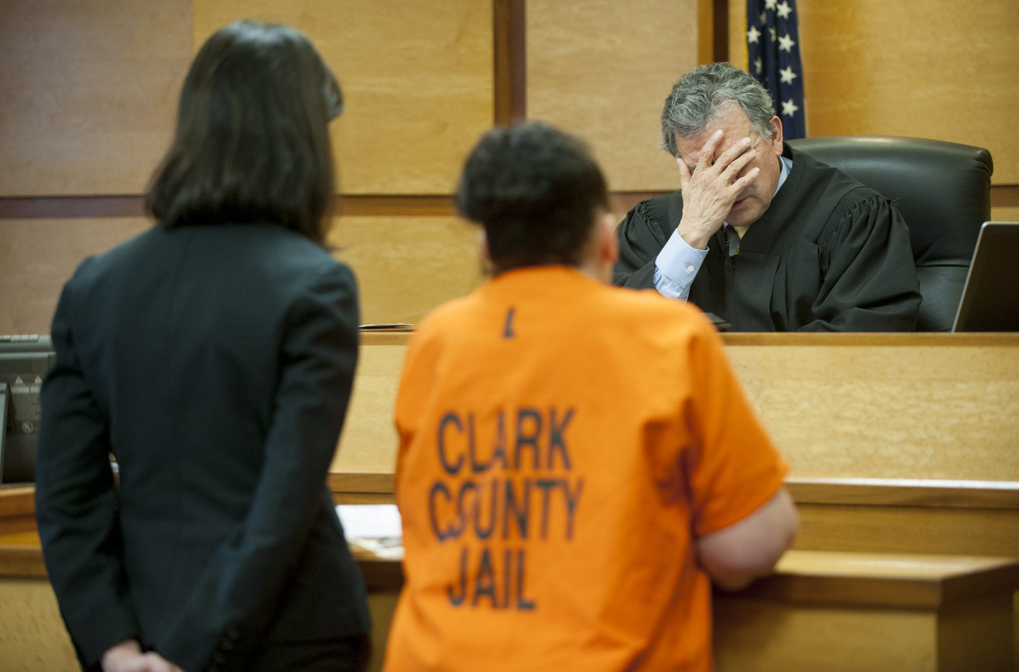 Clark County Superior Court Judge Gregory Gonzales covers his face with his hand as he recounts the details of Tanya Leffler&#039;s drug-distribution case Thursday.
