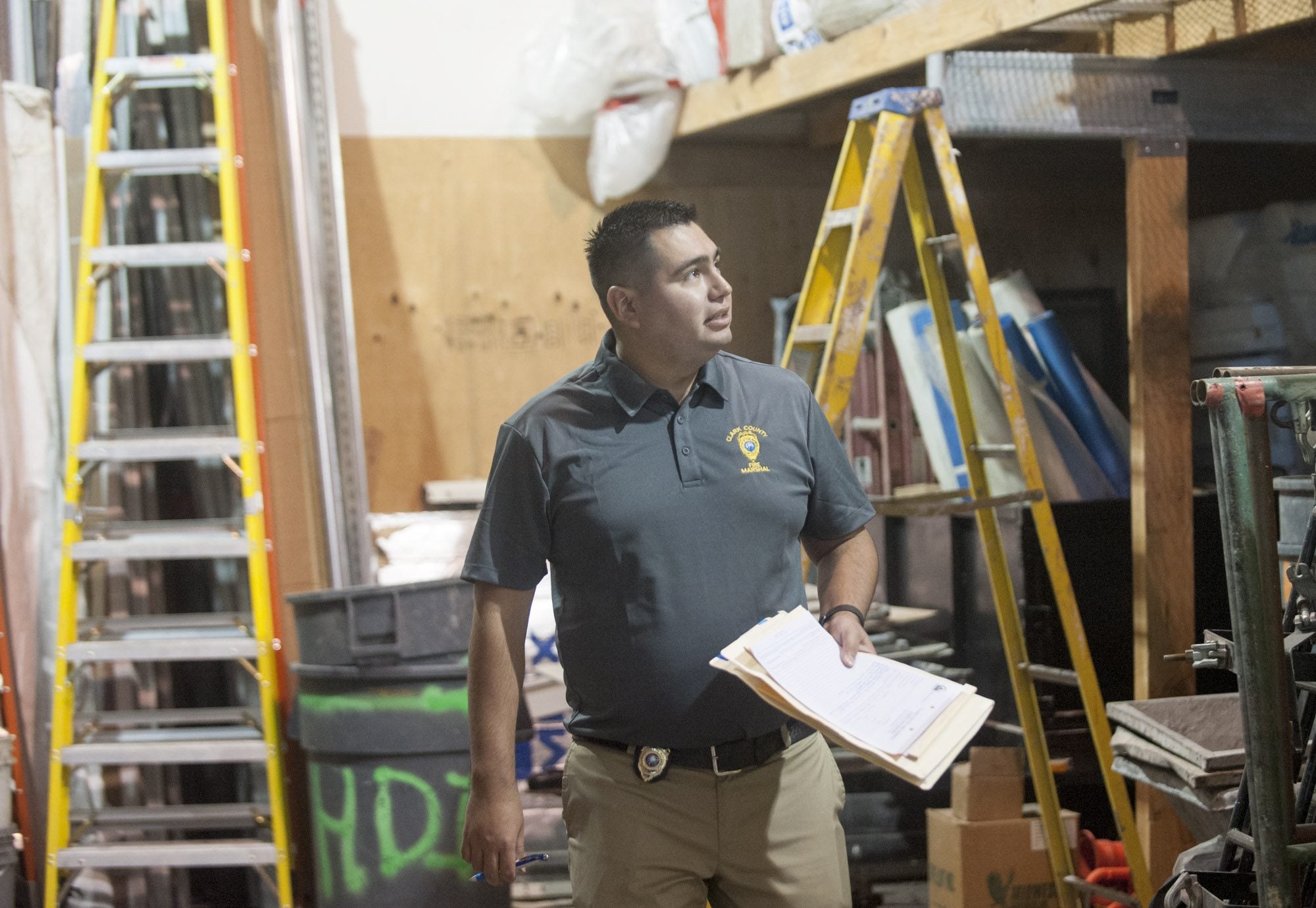 Miguel Bautista , a Clark County fire inspector, examines a business in Vancouver. The Clark County Fire Marshal&#039;s Office is making a plea for more inspectors.