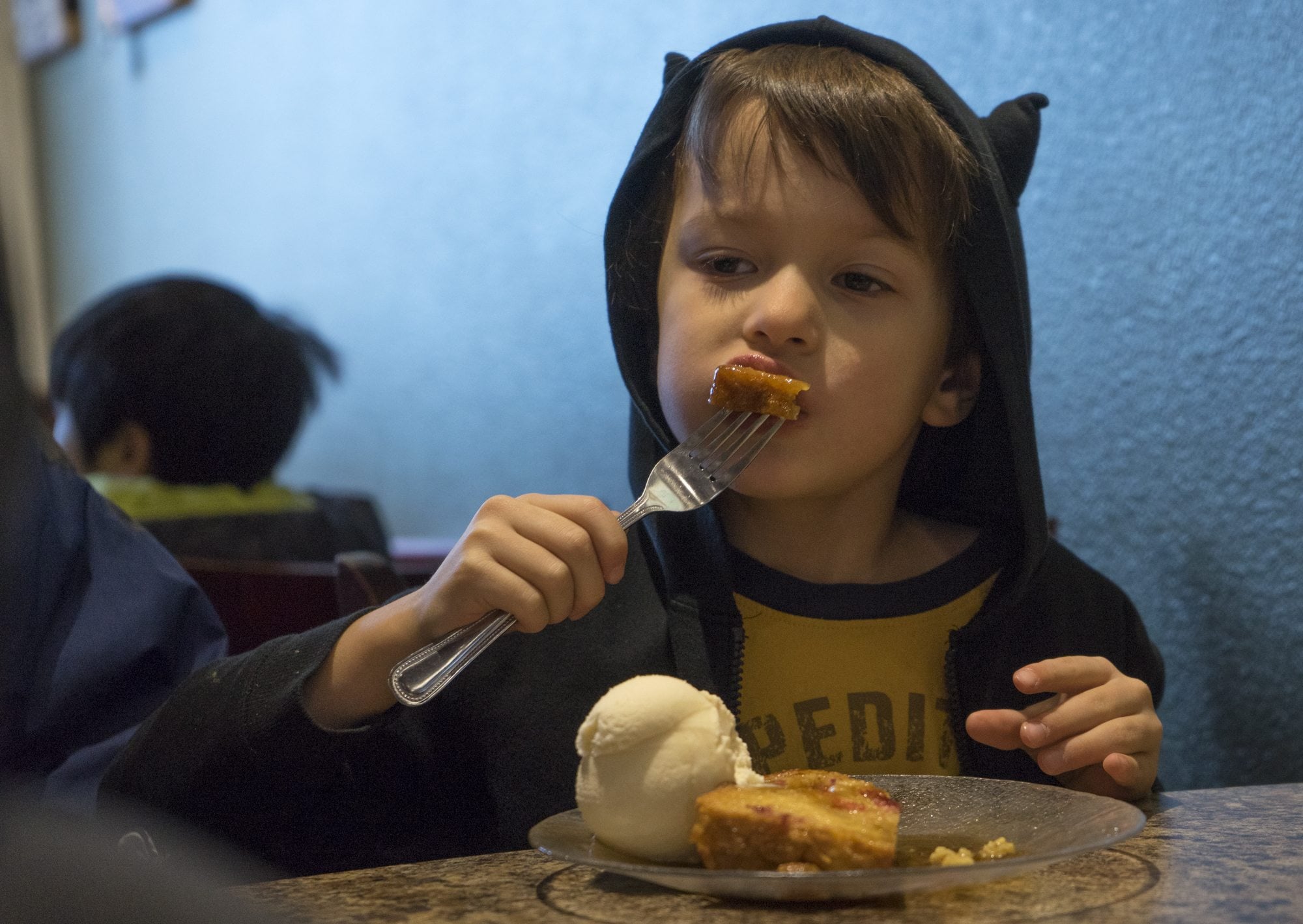Thomas Gallegos, 6, of Vancouver eats a piece of baked French toast at Ice Cream Renaissance on Saturday for Eat Ice Cream for Breakfast Day. Thomas visited the store with his parents, Mike and Sarah Gallegos, and two brothers, Patrick and Anthony.