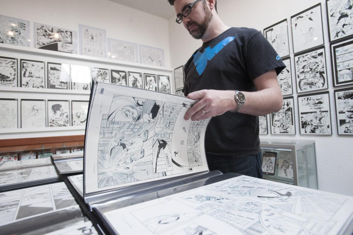 Jerry Livengood, owner of Serendipity Art Sales, looks at original art from the Deadpool comic at I like Comics.
