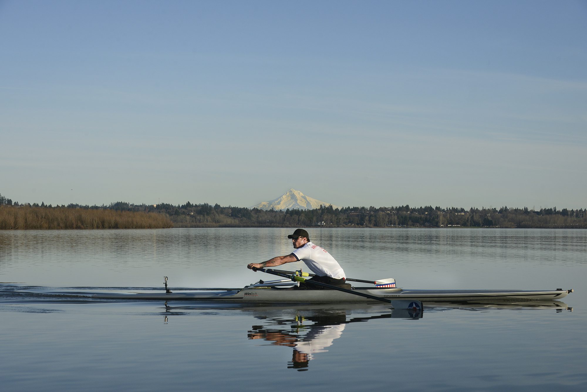 Anthony Davis rows on Vancouver Lake on a perfect day in late January, preparing for the 2016 Paralympics in Rio de Janeiro. Davis, who never rowed before 2009, qualified for the Paralympic/Adaptive National rowing team in 2012.