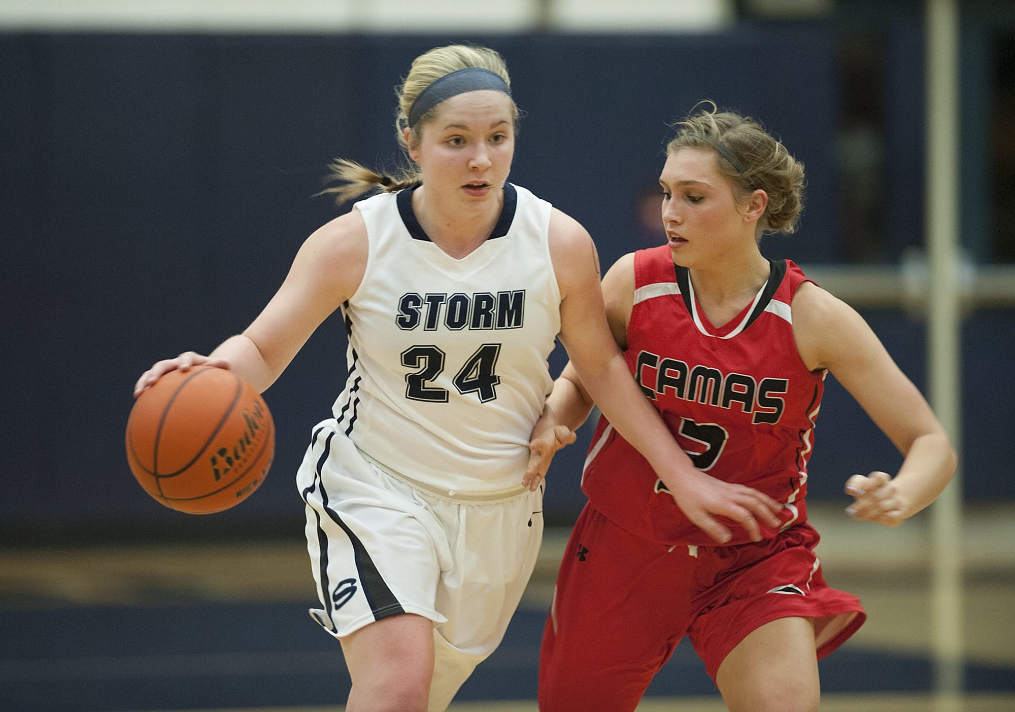 Skyview&#039;s Kirsten Johnson (24) takes on Camas defender Meghan Finley (2) in the second quarter Tuesday night, Feb. 2, 2016 at Skyview High School gym.
