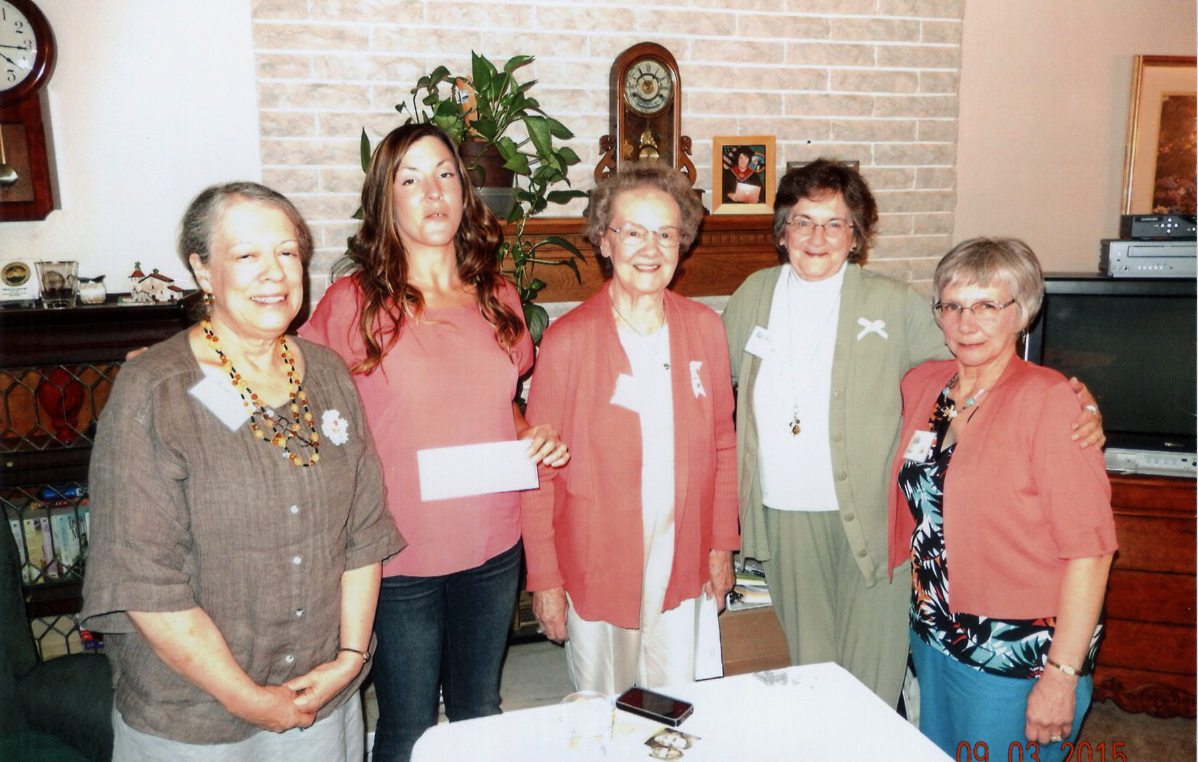 Battle Ground: Philanthropic Educational Organization members Anna Morrison, left, Beverly Osieck, from center, Becky Robert and Julie Tanner present an education grant to Melissa Macaree, second from left.