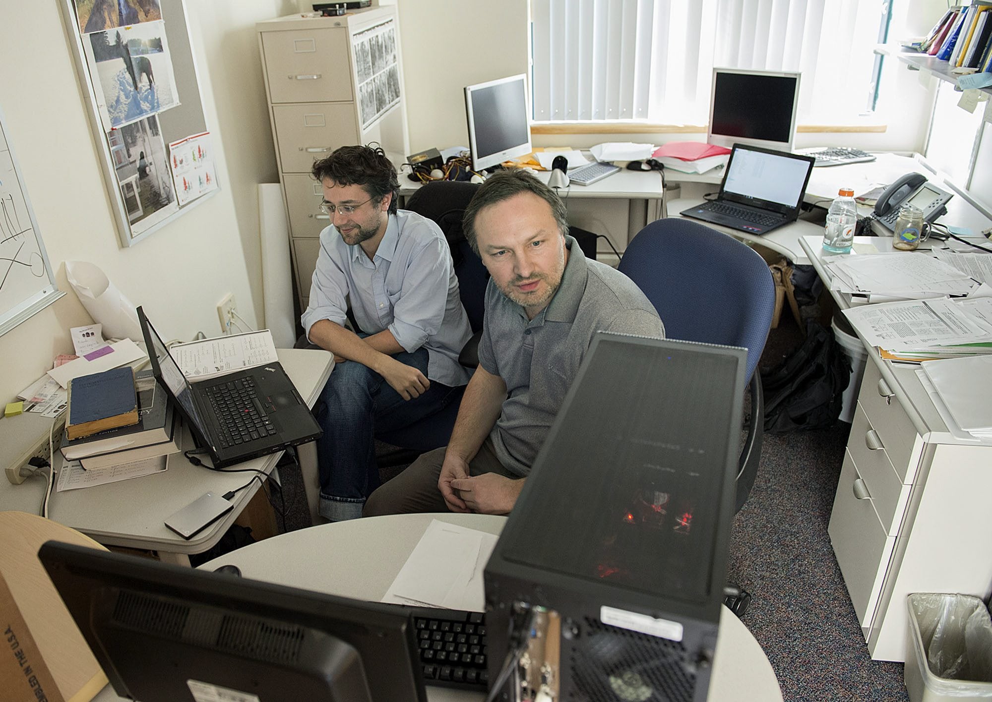 Jean Liénard, left, and Nikolay Strigul run a computer simulation to grow a digital forest Thursday in Strigul&#039;s office on the Washington State University Vancouver campus.