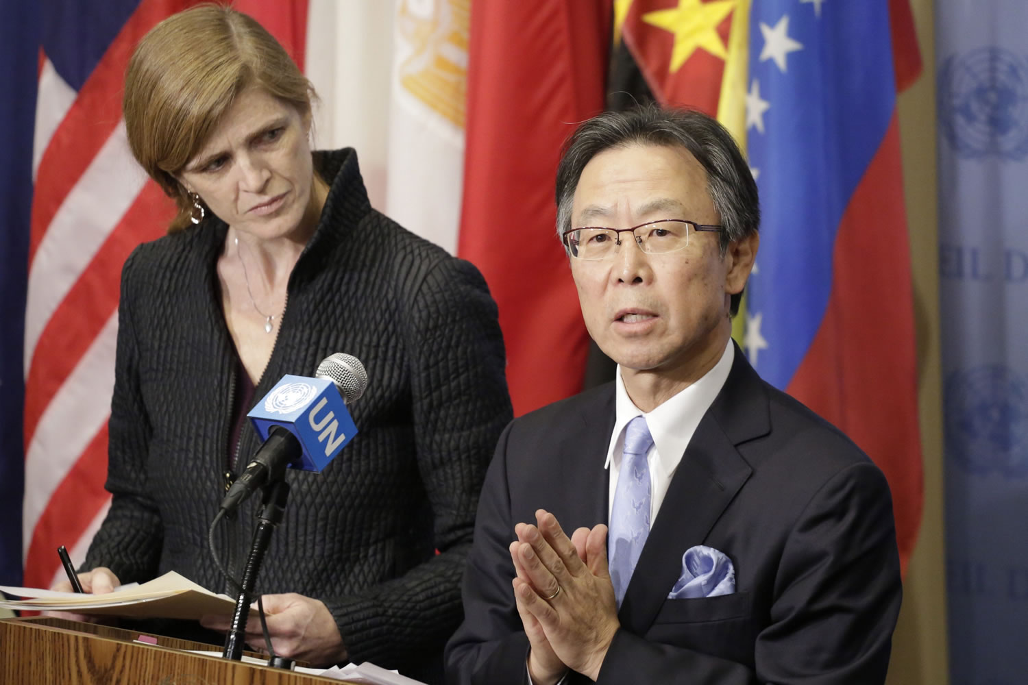 Samantha Power, left, the U.S. Ambassador to the United Nations, listens as Motohide Yoshikawa, Japan&#039;s ambassador, makes comments to the media following a Security Council meeting at U.N. headquarters on Sunday.
