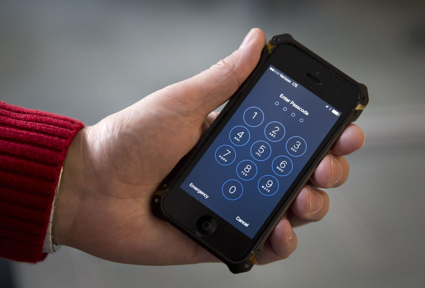 An iPhone is seen in Washington, Wednesday, Feb. 17, 2016. A U.S. magistrate judge has ordered Apple to help the FBI break into a work-issued iPhone used by one of the two gunmen in the mass shooting in San Bernardino, California, a significant legal victory for the Justice Department in an ongoing policy battle between digital privacy and national security. Apple CEO Tim Cook immediately objected, setting the stage for a high-stakes legal fight between Silicon Valley and the federal government.