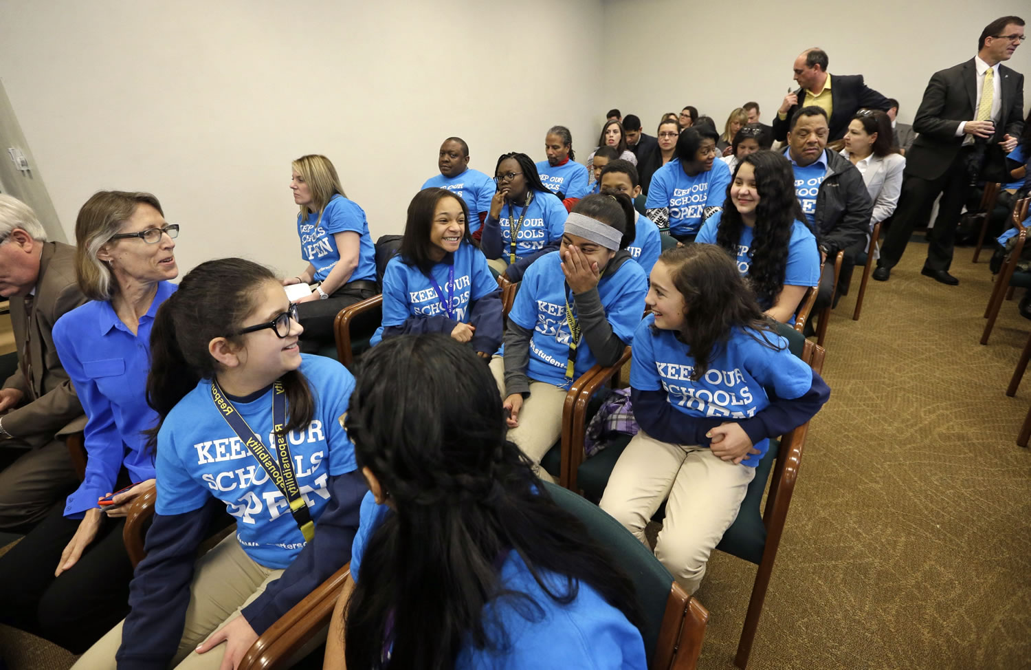 Students in support of charter schools wear blue tee shirts as they sit in the back of a House Education Committee hearing room before testimony about a bill designed to keep Washington&#039;s charter school system alive Friday in Olympia. The bill has already passed the Senate.