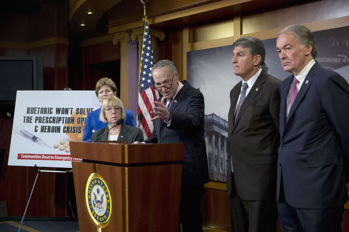 Sen. Charles Schumer, D-N.Y., center, accompanied by, from left, Sen. Jeanne Shaheen, D-N.H., Sen. Patty Murray, D-Wash., Sen. Joe Manchin, D-W.Va., and Sen. Edward Markey, D-Mass., speaks Thursday during a news conference on opioid and heroin abuse.