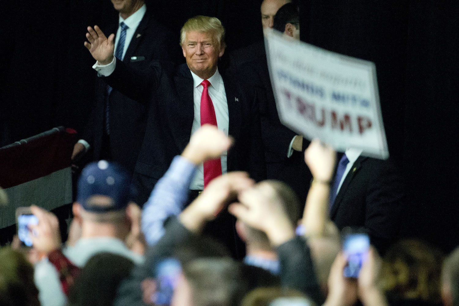 Republican presidential candidate Donald Trump waves during a campaign stop Tuesday in Milford, N.H.