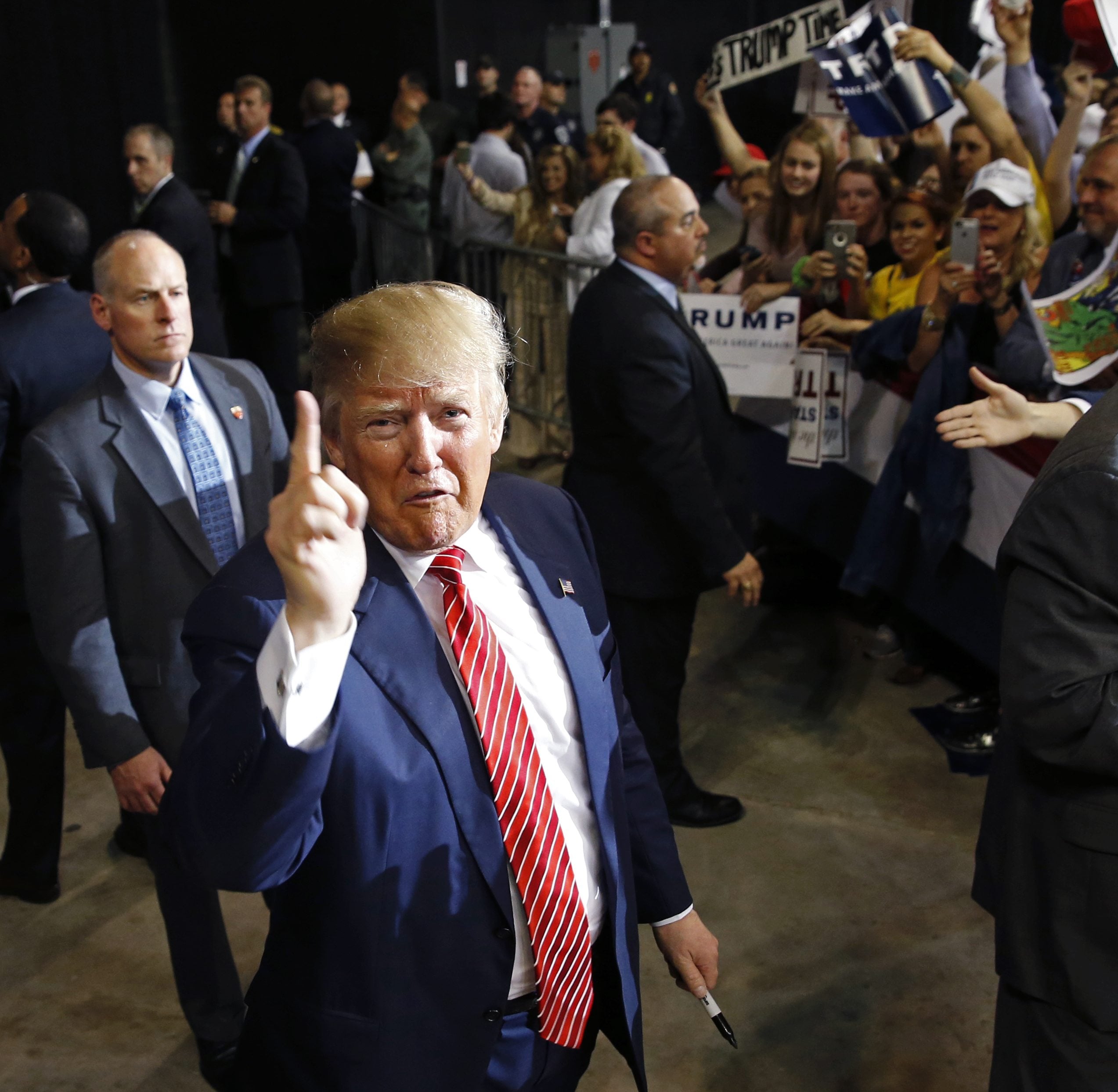Republican presidential candidate Donald Trump thanks photographers as he greets the crowd after speaking at a campaign rally in Baton Rouge, La., Thursday, Feb. 11, 2016.