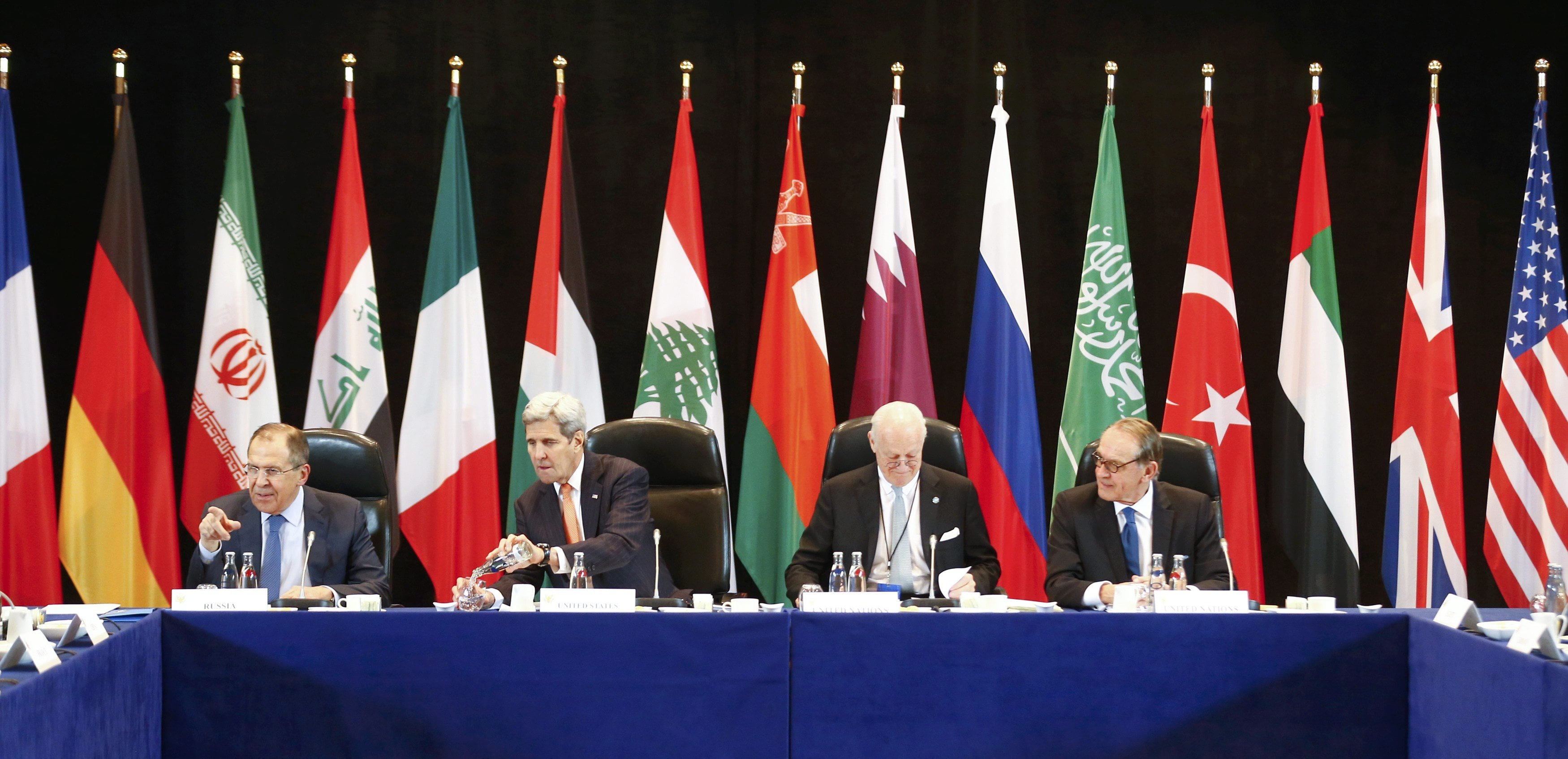 Russian Foreign Minister Sergey Lavrov , left, and U.S. Secretary of State, John Kerry , second left,  attend the International Syria Support Group (ISSG) meeting in Munich, Germany,Thursday Feb. 11, 2016, together with members of the Syrian opposition and other officials.