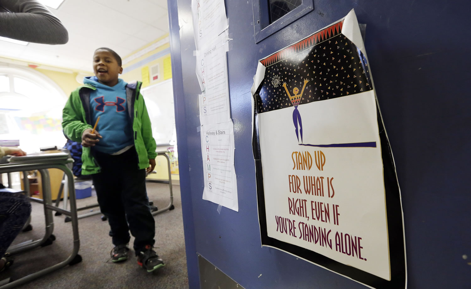Fourth grader Christopher Wilson walks out of a classroom at First Place Scholars school in Seattle on Feb. 8.