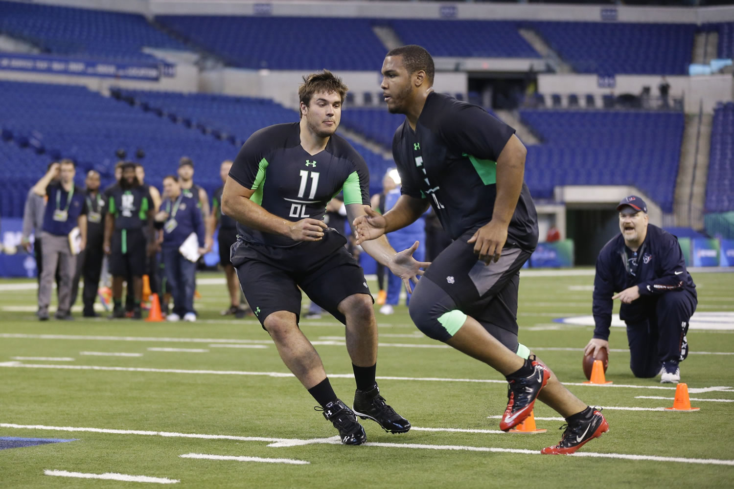 Michigan State offensive lineman Jack Conklin, left, blocks Western Michigan offensive lineman Willie Beavers during a drill at the NFL football scouting combine in Indianapolis, Friday, Feb. 26, 2016.