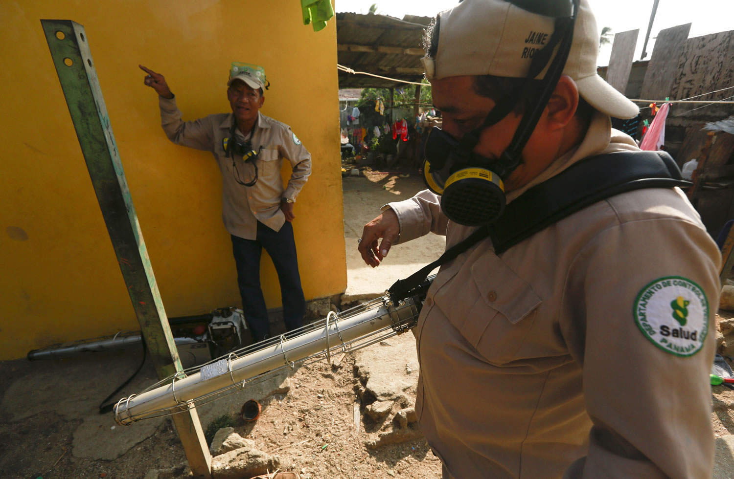 Health Ministry workers get ready to fumigate for the Aedes aegypti mosquito in Veracruz, Panama, on Thursday. The Aedes aegypti mosquito is vector for the spread of the Zika virus.
