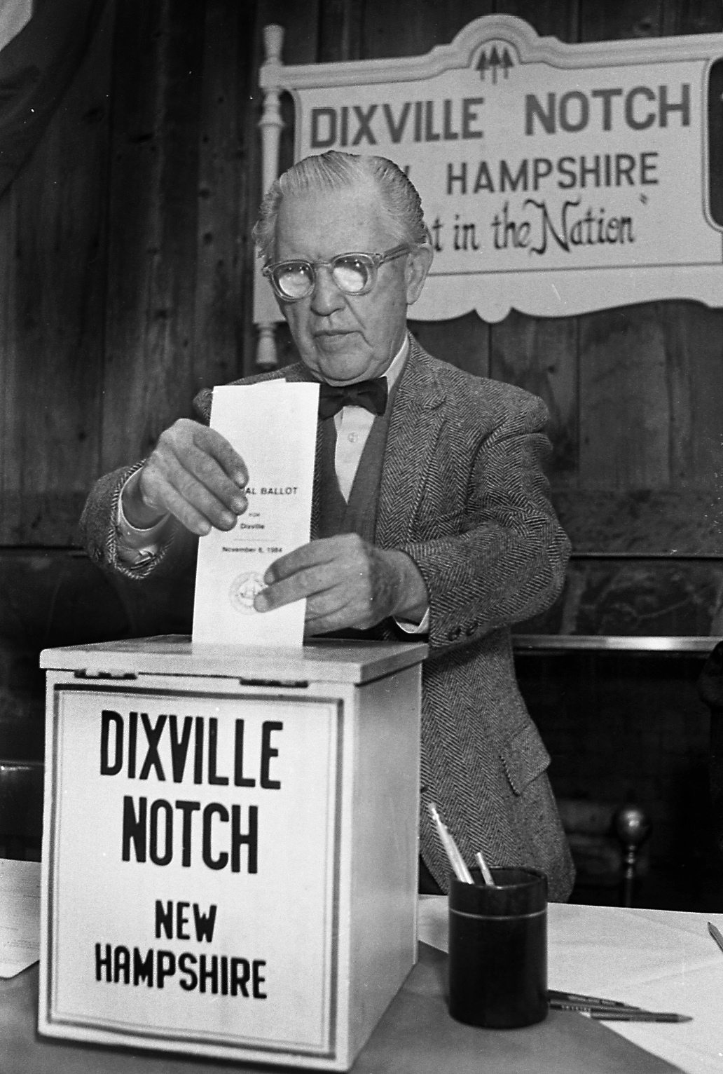 FILE - In this Feb. 28, 1984, file photo, Neil Tillotson gets ready to cast the first ballot in the New Hampshire presidential primary in Dixville, N.H. In Dixville, one of three tiny northern towns where voters cast ballots just after midnight Feb. 9, no one quite knows how the early voting tradition started. But most agree it had something to do with rival news photographers wanting to report first.
