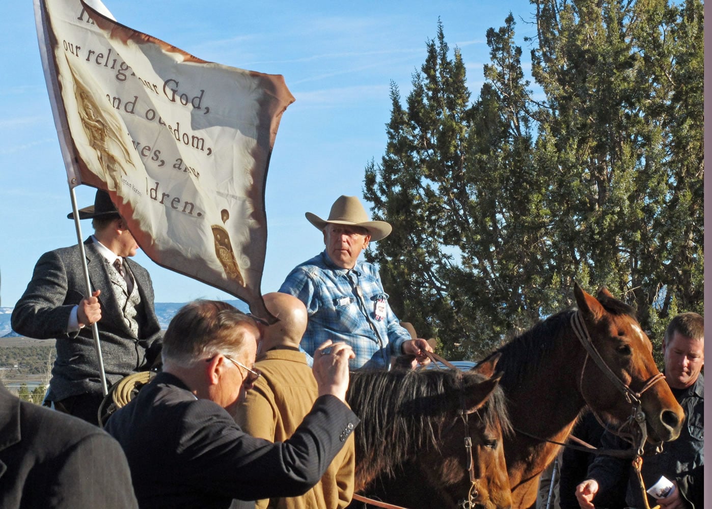 Cliven Bundy, on horseback at center, joins the funeral procession for Arizona rancher Robert "LaVoy" Finicum in Kanab, Utah, on  Feb. 5. Hundreds of people packed a Mormon church in rural Utah for the viewing ceremony for the fallen spokesman of the Oregon armed standoff. Police shot and killed Finicum during a Jan. 26 traffic stop after they say he reached for a gun.