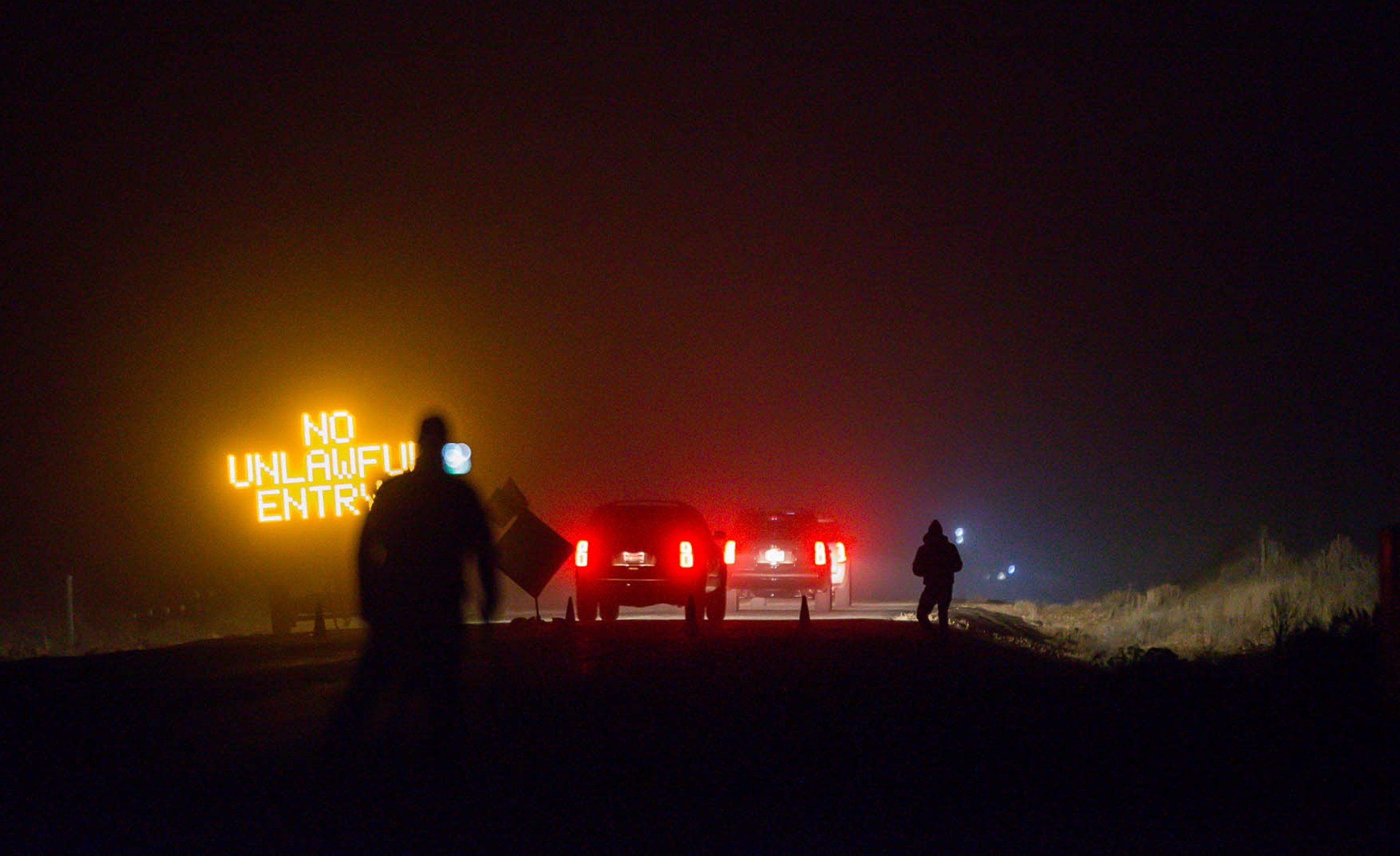 Three SUV proceeds through the Narrows roadblock near Burns, Ore., as FBI agents have surrounded the remaining four occupiers at the Malheur National Wildlife Refuge, on Wednesday, Feb.10, 2016. The four are the last remnants of an armed group that seized the Malheur National Wildlife Refuge on Jan. 2 to oppose federal land-use policies.