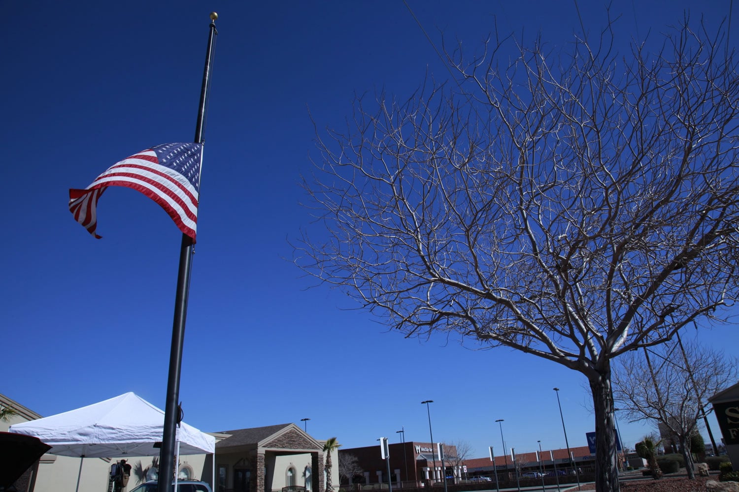 A flag flies at half-staff outside the funeral home taking care of the body of U.S. Supreme Court Justice Antonin Scalia on Sunday in El Paso, Texas. Scalia died while vacationing at a secluded ranch near the Texas-Mexico border over the weekend.