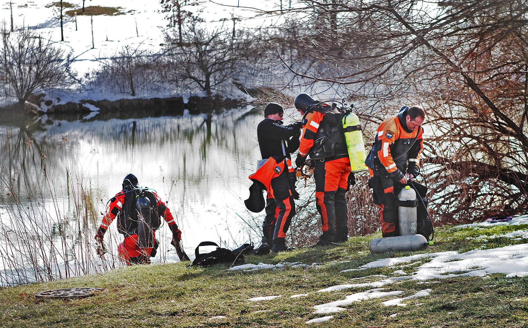 Troopers prepare to search the Duck Pond in Blacksburg, Va., Jan. 30. The investigation continued in the death of Nicole Madison Lovell as a state police search and recovery team searched the pond for evidence on the Virginia Tech Campus.