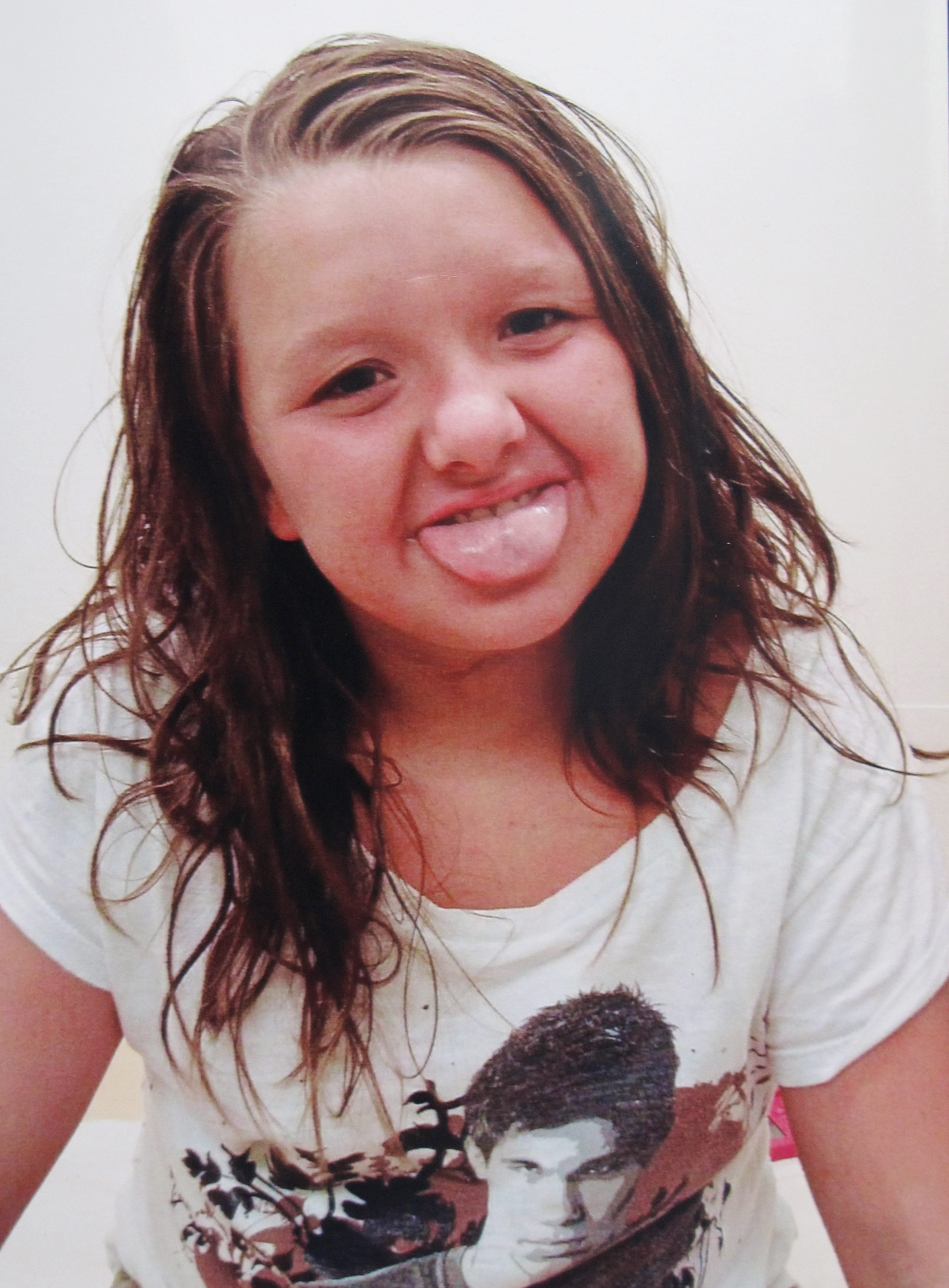 This undated photo provided by Tammy Weeks shows her daughter, Nicole Lovell, posing when she was 10 in Blacksburg, Va. The 13-year-old girl was found dead just across the state line in Surry County, N.C., and two Virginia Tech students are charged in the case.