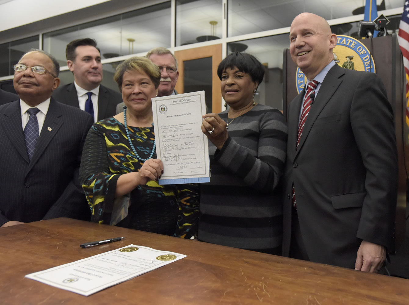 Delaware Gov. Jack Markell, right, stands with state legislators, from left, Rep. J.J. Johnson, Rep. Sean Lynn, Sen. Margaret Rose Henry, Sen. Brian Bushweller and Rep. Stephanie Bolden, after signing House Joint Resolution 10, which apologizes for the state&#039;s role in slavery Wednesday at the Delaware Public Archives in Dover, Del. Markell also presented a proclamation recognizing African American History Month.