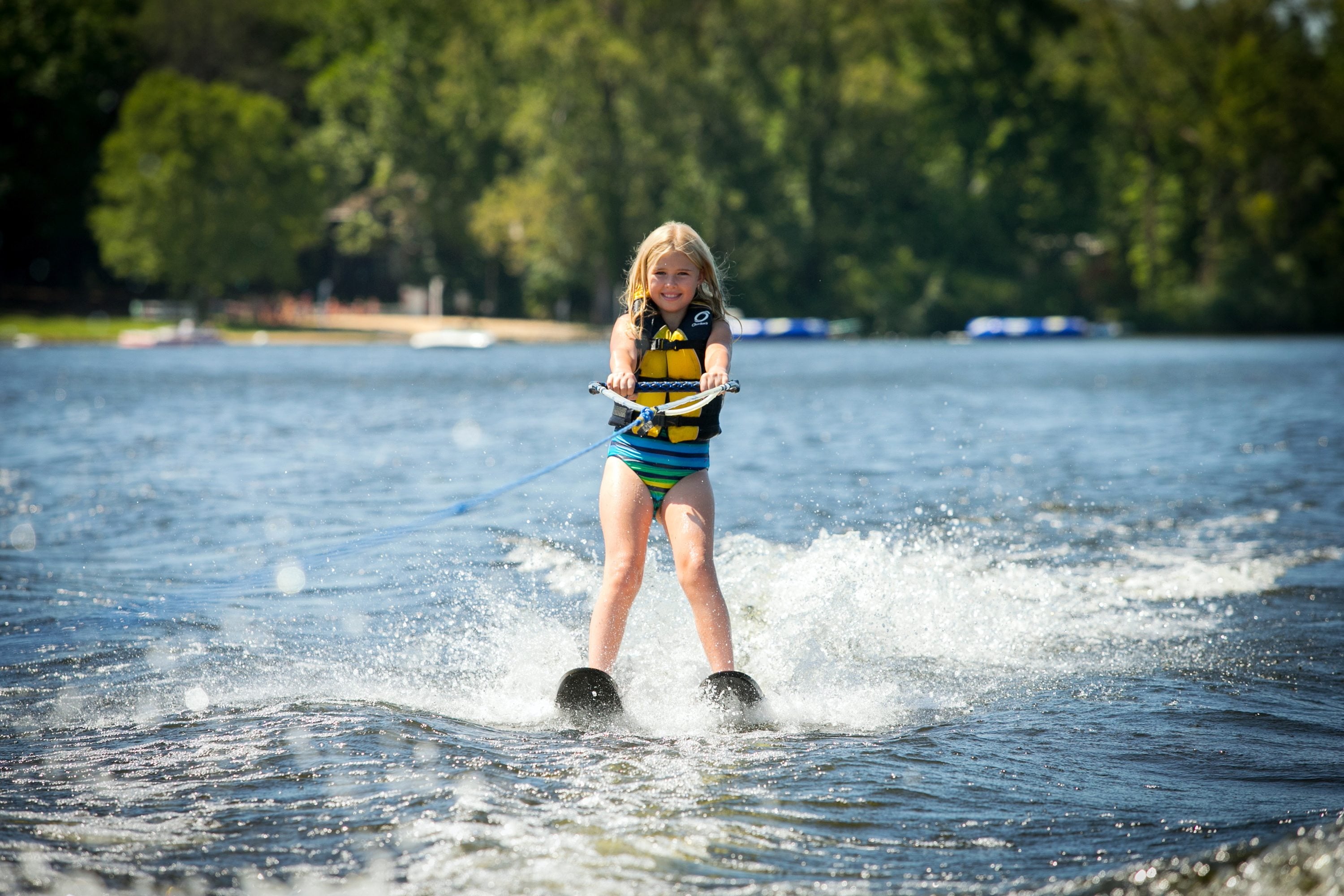 A girl water skis during summer camp in Decatur, Mich. Lake of the Woods Camp for Girls and Greenwoods Camp for Boys host 1,275 campers each summer and works with approximately eight advisory services.
