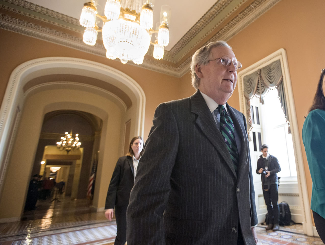 Senate Majority Leader Mitch McConnell walks to the chamber where he offered a tribute to the late Supreme Court Justice Antonin Scalia whose death has triggered an election-year political standoff, on Capitol Hill in Washington on Monday.(AP Photo/J.