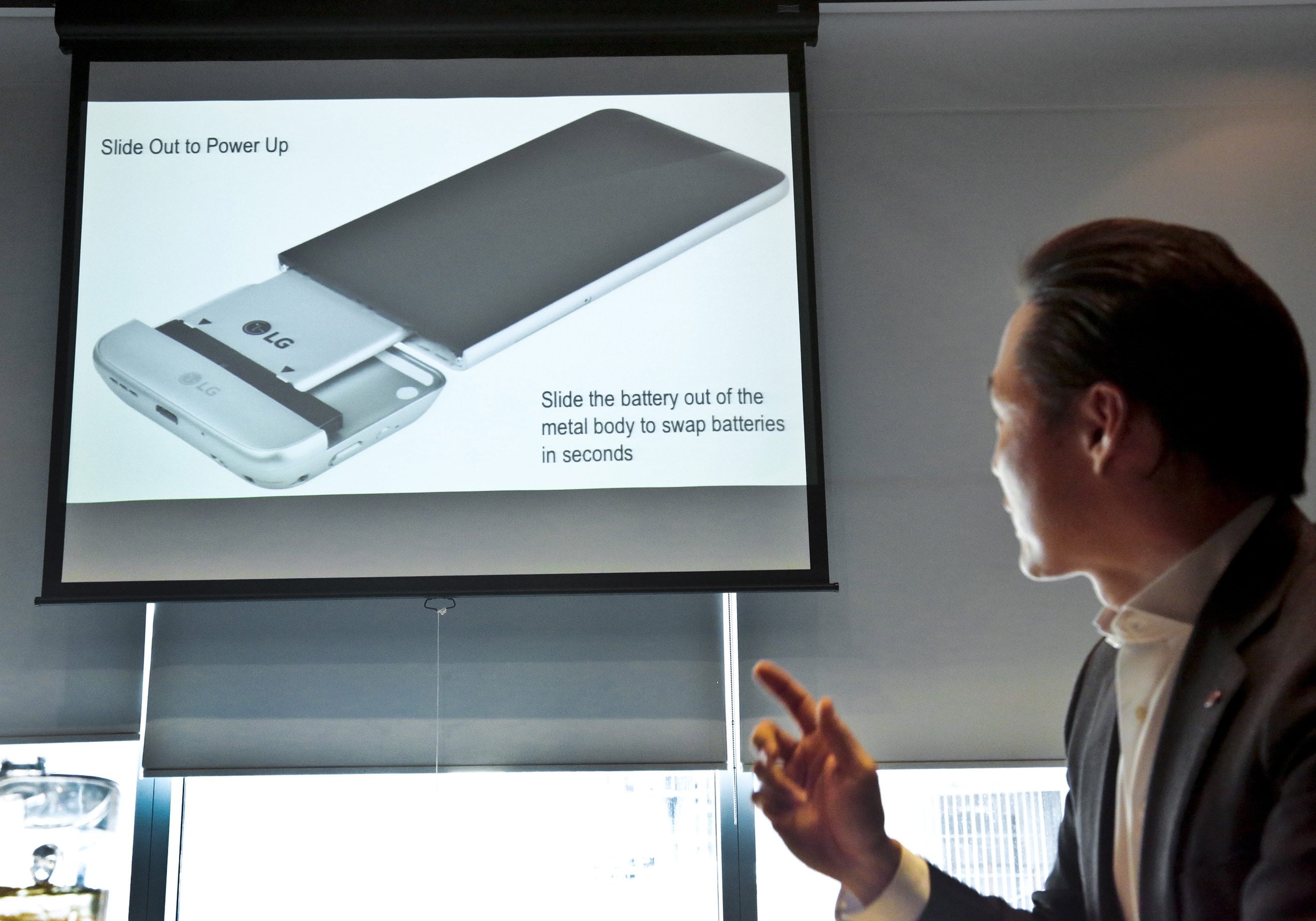 Frank Lee, director of communications for LG&#039;s U.S. mobile business, introduces the LG G5 phone with the bottom of the phone pulled out, in New York. The phone&#039;s bottom contains the battery, which can be removed and inserted into a different module with extra features, such as a camera grip with physical shutter buttons.