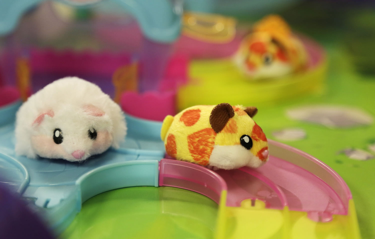 Hamster in a House, from Zuru Toys. Nine fuzzy hamsters scurry around tracks to the different hamster houses.