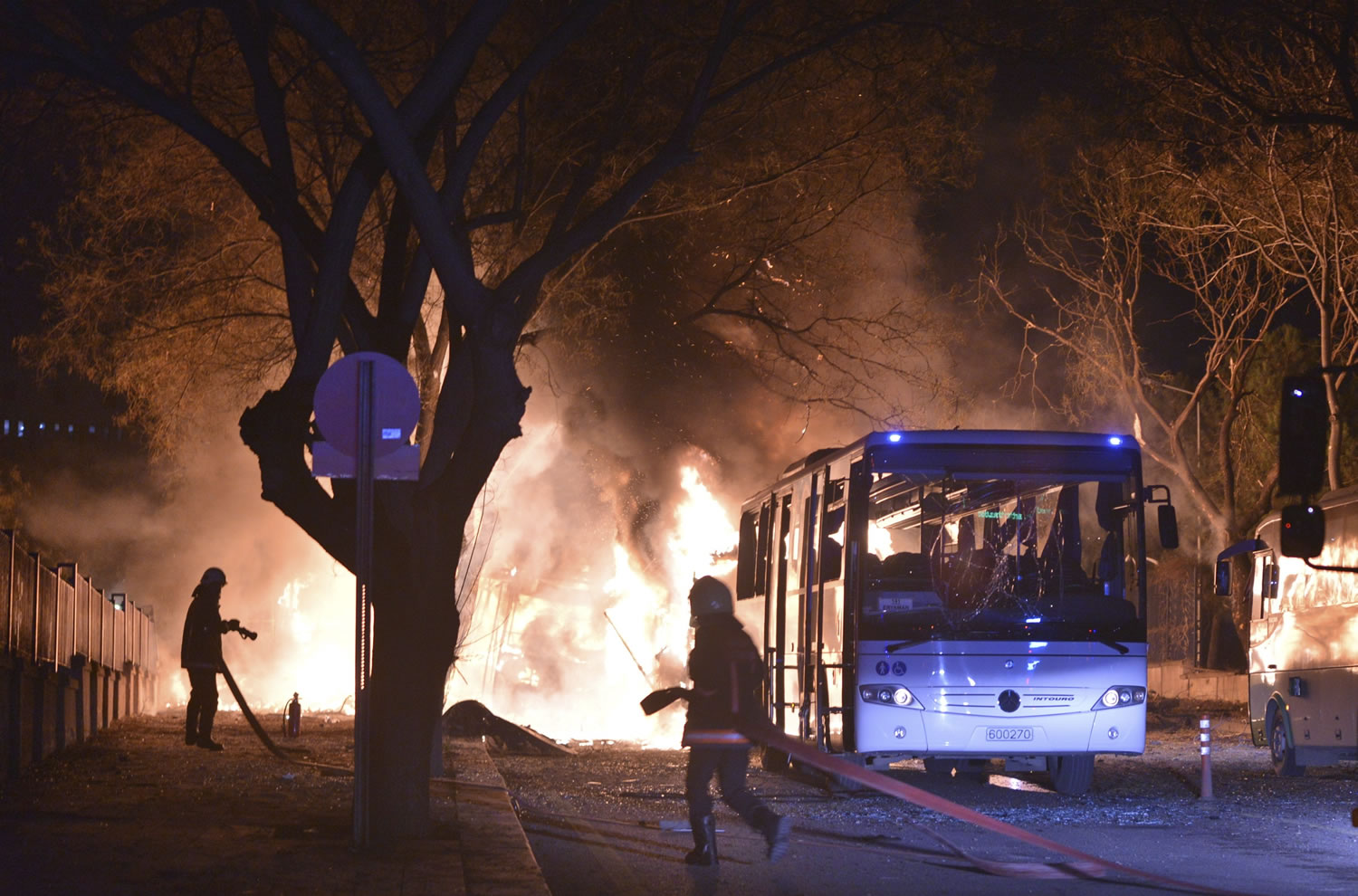 Firefighters work at the scene of a fire from an explosion Wednesday  in Ankara, Turkey. A large explosion, believed to have been caused by a car bomb, killed at least 28 people in the Turkish capital on Wednesday, according to media reports.