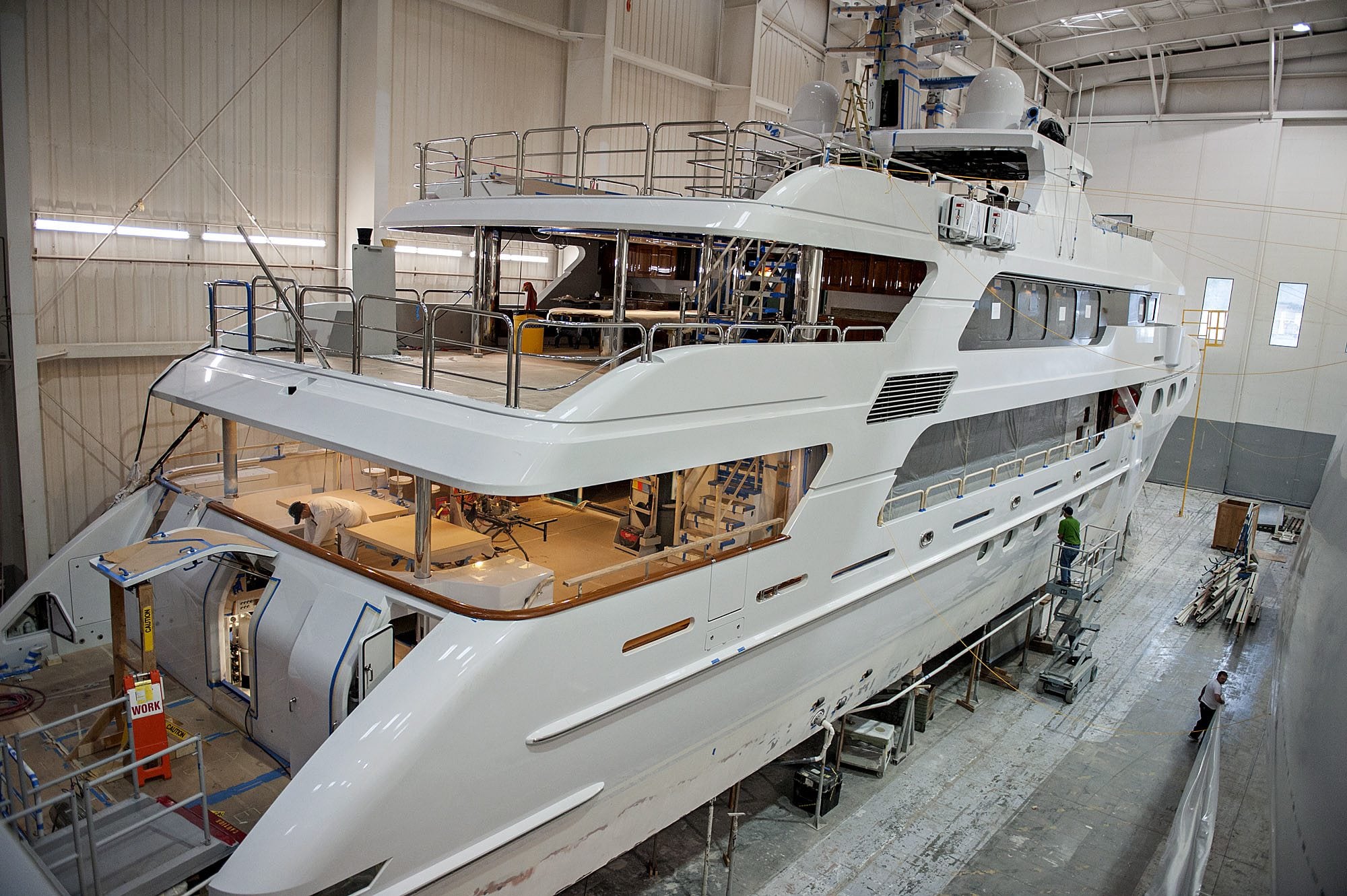 Employees of Christensen Shipyards work aboard a luxury yacht under construction Wednesday afternoon, Jan. 20, 2016 at in Southeast Vancouver.
