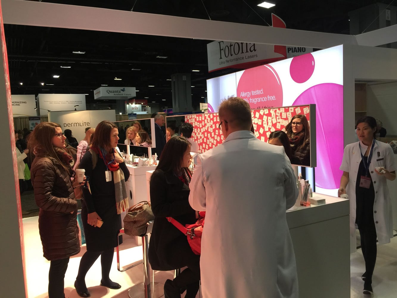 At the Clinique booth at the American Academy of Dermatology meeting, held at the Walter E. Washington Convention Center in Washington earlier this month, visitors get lipstick applied.