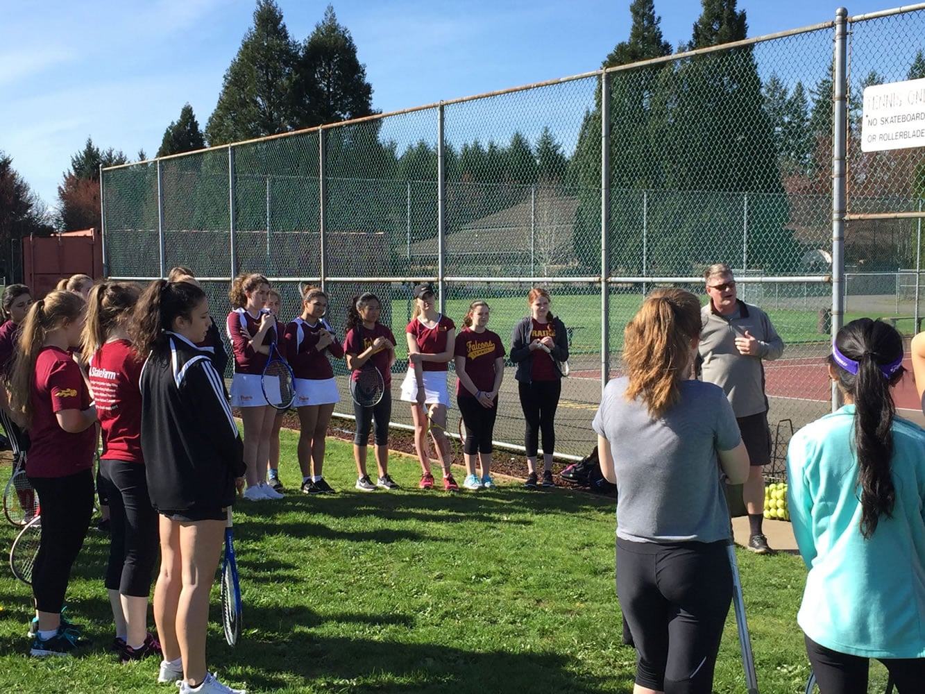 Prairie and Union tennis players receive instructions before the start of junior varsity and C team matches Wednesday at Prairie High School (Micah Rice/The Columbian)