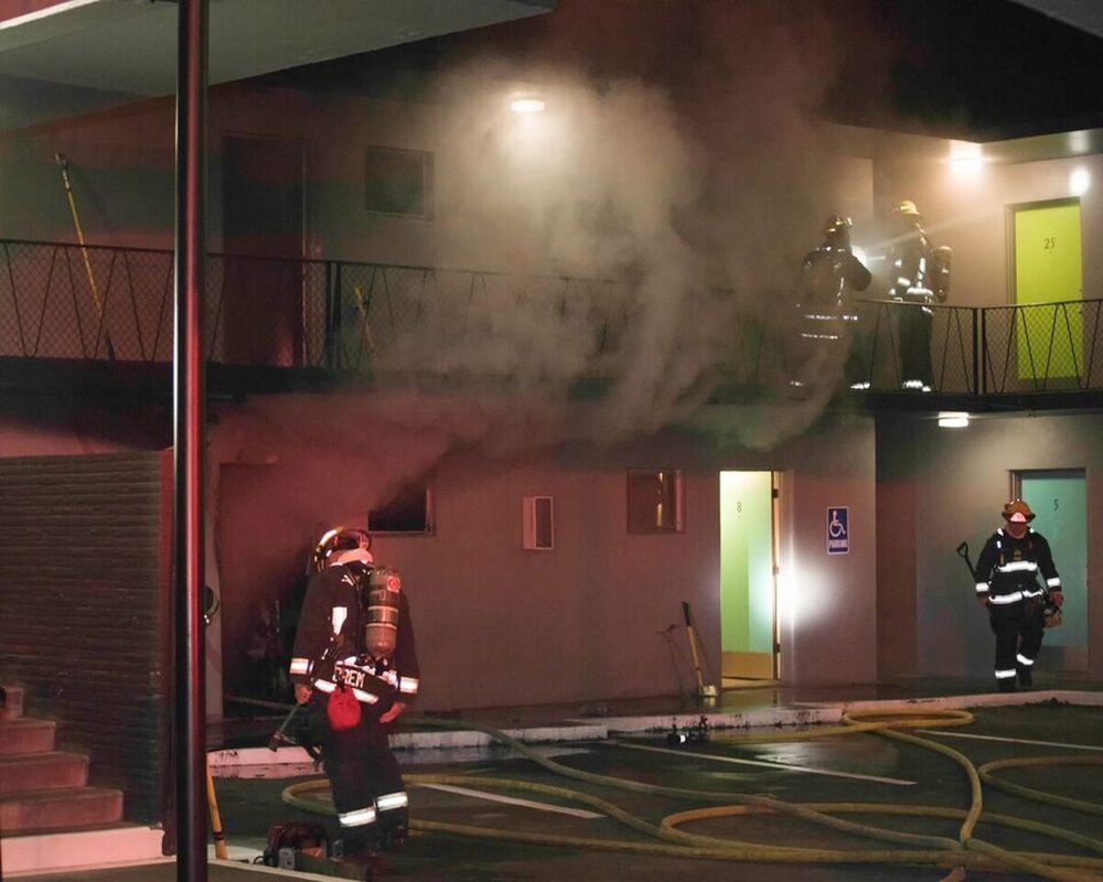Firefighters from the Vancouver Fire Department respond Friday night to The Hudson Apartments, where a fire had been reported in a ground-floor studio.