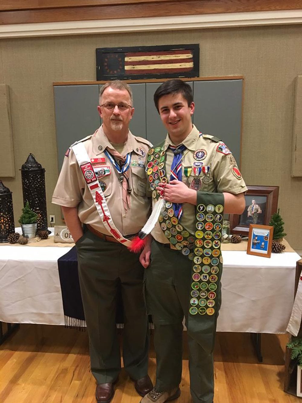 Jourdan Hale, right, receives his final three merit badges and his Order of the Arrow vigil feather recently with Ron Shake, eagle chair for the Boy Scouts of America&#039;s Columbia Gorge district.