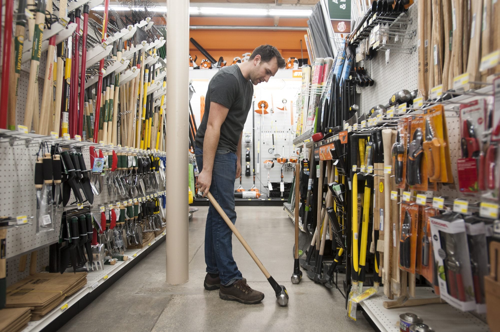 Werner Letsch, a customer at the new Parkrose Hardware store at 8000 E. Mill Plain Blvd., shops for sledge hammers.