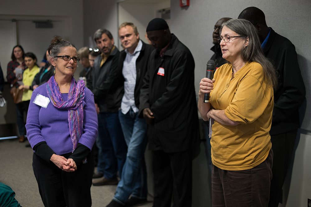Diana Robinson-Weiss, right, a Jewish women who lives in Vancouver, asks a question Sunday afternoon during a talk titled &quot;A Conversation with Your Muslim Neighbors&quot; at Washington State University Vancouver.