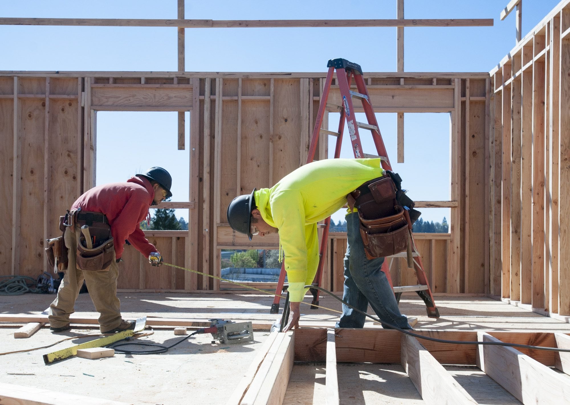 Juan Garcia, right, works Tuesday on framing a room at the Isabella Court apartment complex construction site in central Vancouver. A 180-unit apartment building is planned nearby at 5500 N.E. Fourth Plain Blvd.