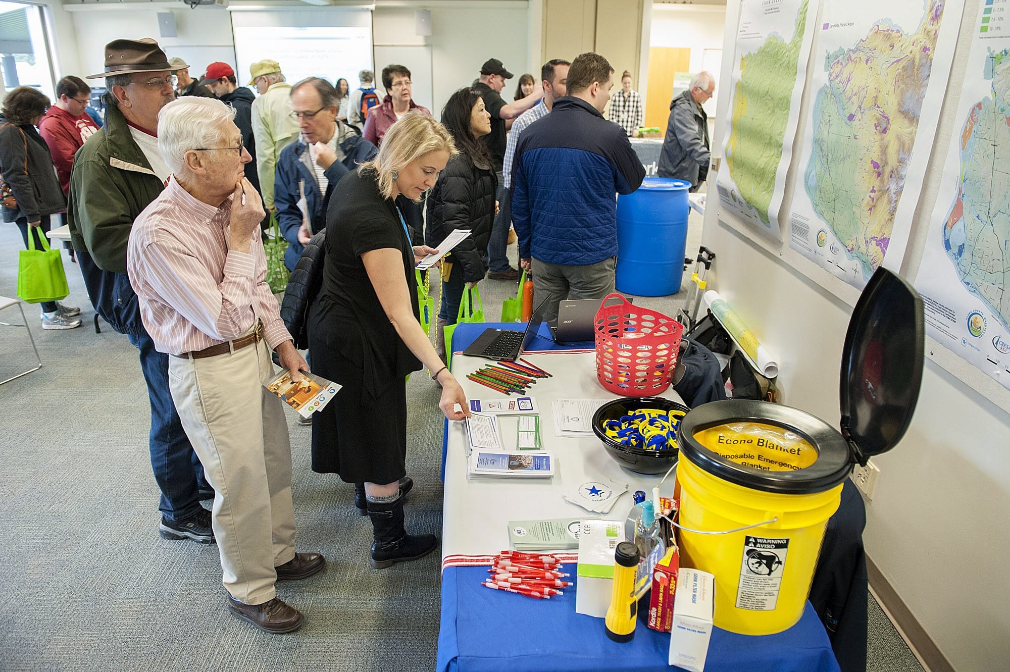 A crowd inspects emergency disaster kits Thursday at the Washington State University Vancouver campus.