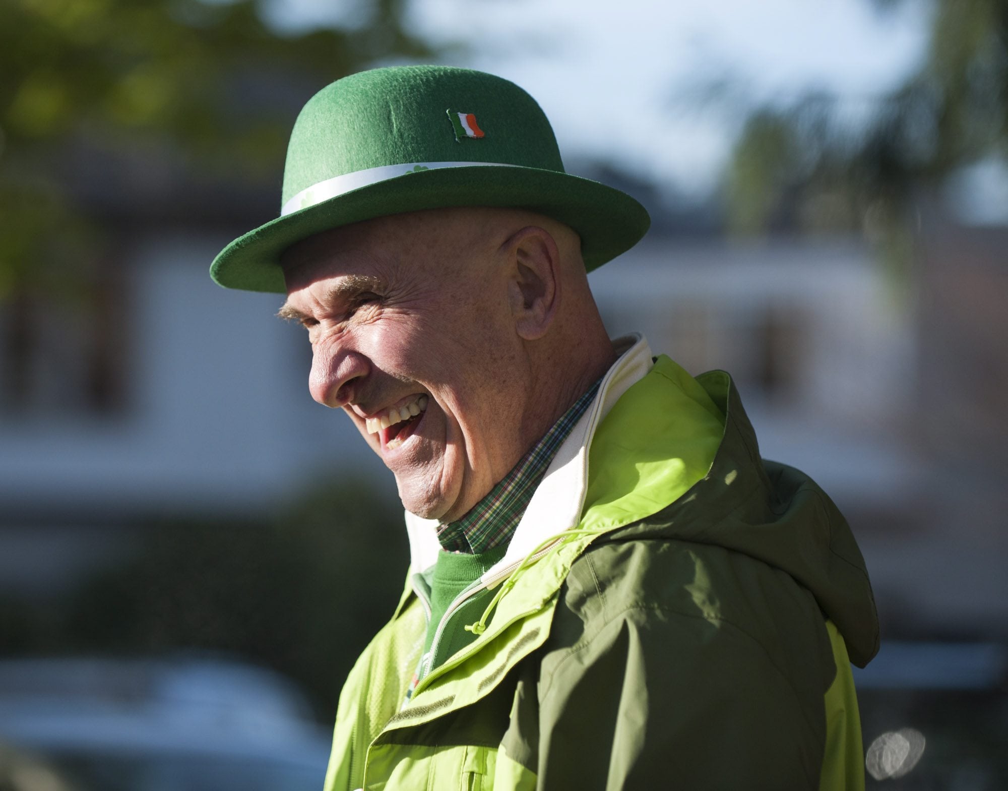 Mike Klein, the grandson of Denny Lane, shares a laugh with family members as they gather Thursday to raise an Irish flag on the south lawn of the Clark County Courthouse on St. Patrick&#039;s Day.