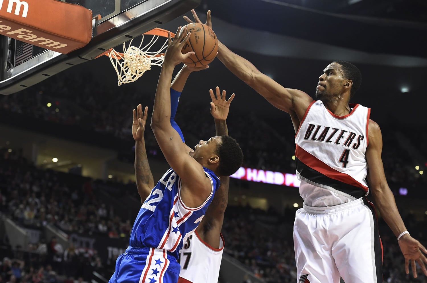 Portland&#039;s Maurice Harkless (4) blocks the shot of Philadelphia&#039;s Richaun Holmes, left, during the Trail Blazers&#039; victory Saturday over the 76ers.