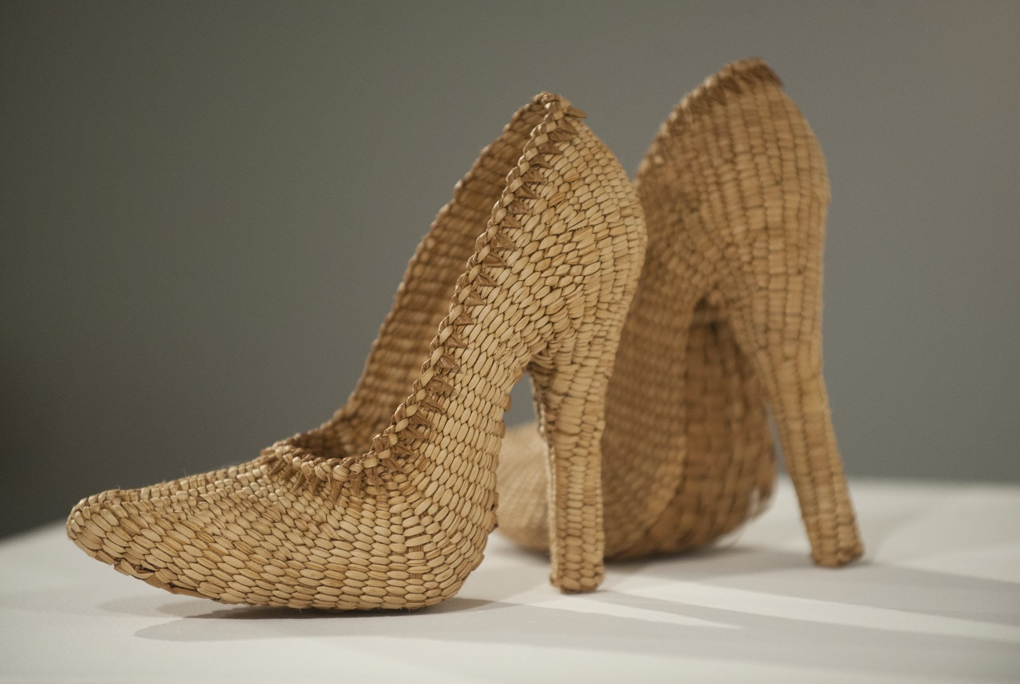 A pair of high heels, titled &quot;Too Haida&quot; by Lisa Telford, are on display at a contemporary native basketry exhibit at Clark College&#039;s Archer Gallery in Vancouver.