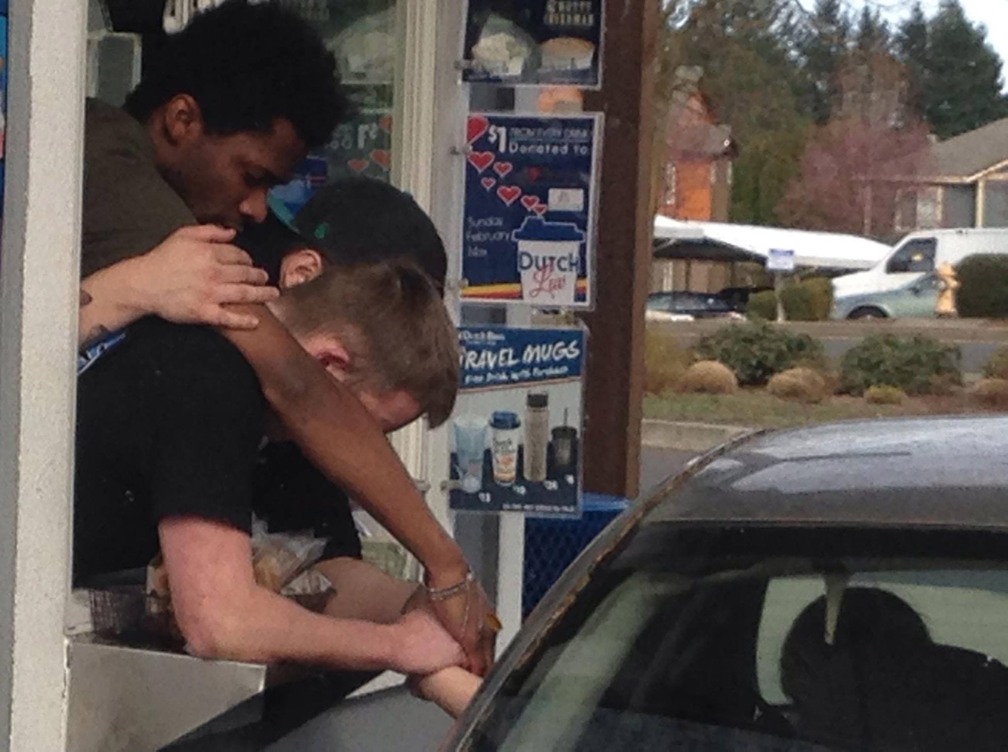 A picture of employees from a Vancouver Dutch Bros. on Northeast 138th Avenue consoling a customer went viral on Facebook after it was posted Saturday.