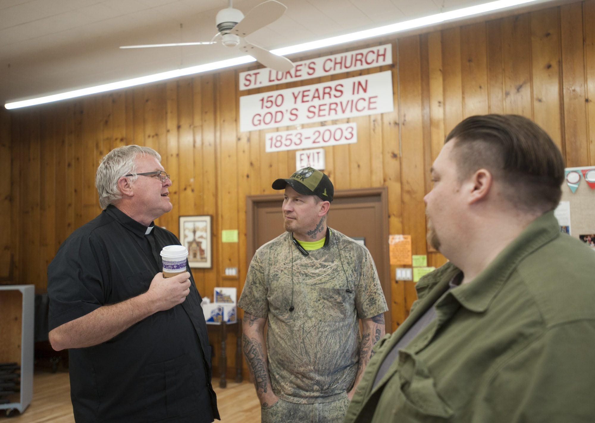 The Rev. David Knudtson, from left, speaks with Rick James and Anthony Mann at a meeting of the Unhoused Residents Association at St. Luke&#039;s Episcopal Church in Vancouver. The three of them represent agencies that benefit the homeless.