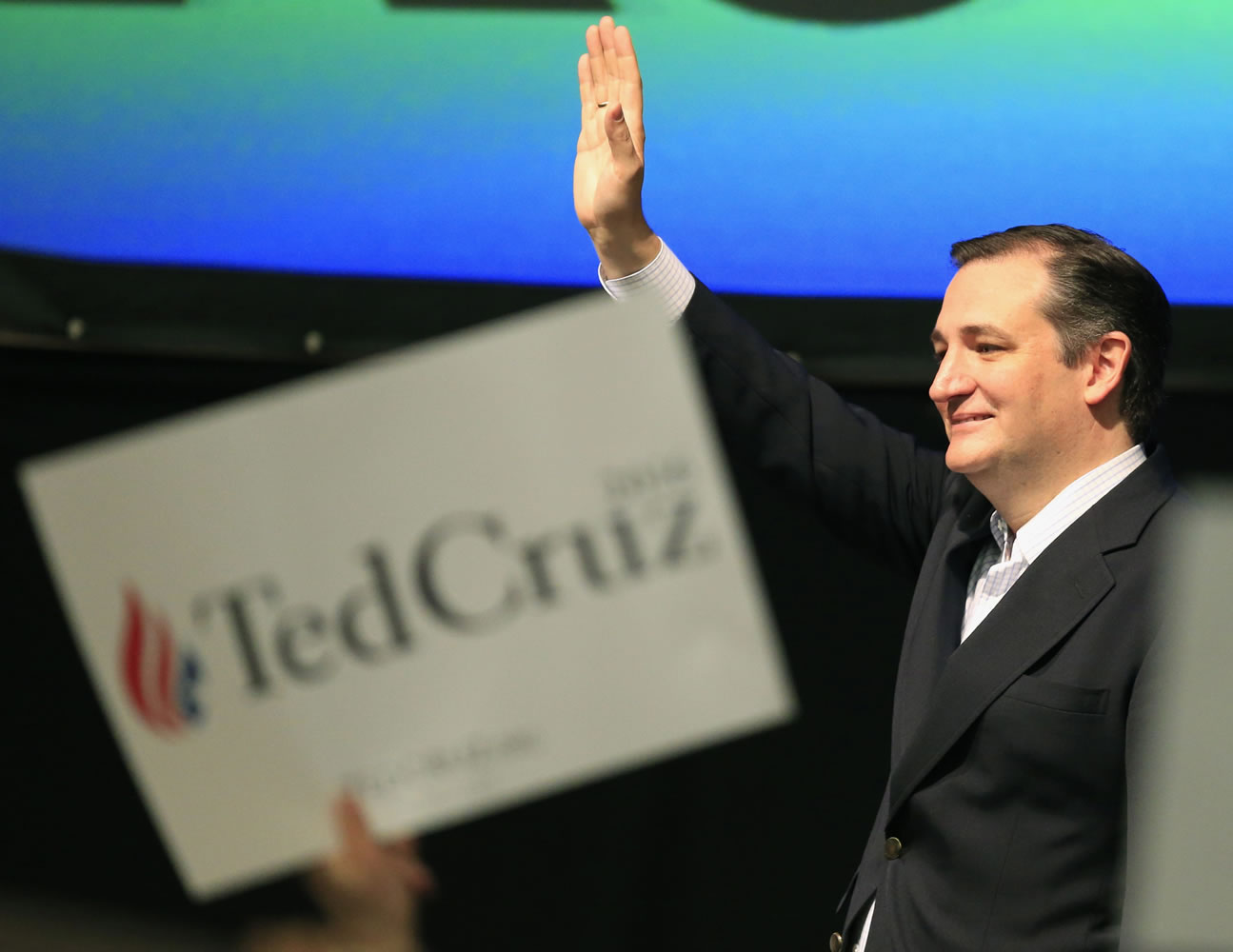 Republican presidential candidate Sen. Ted Cruz, R-Texas, waves to the crowd Saturday at the GOP caucus in Wichita, Kan.