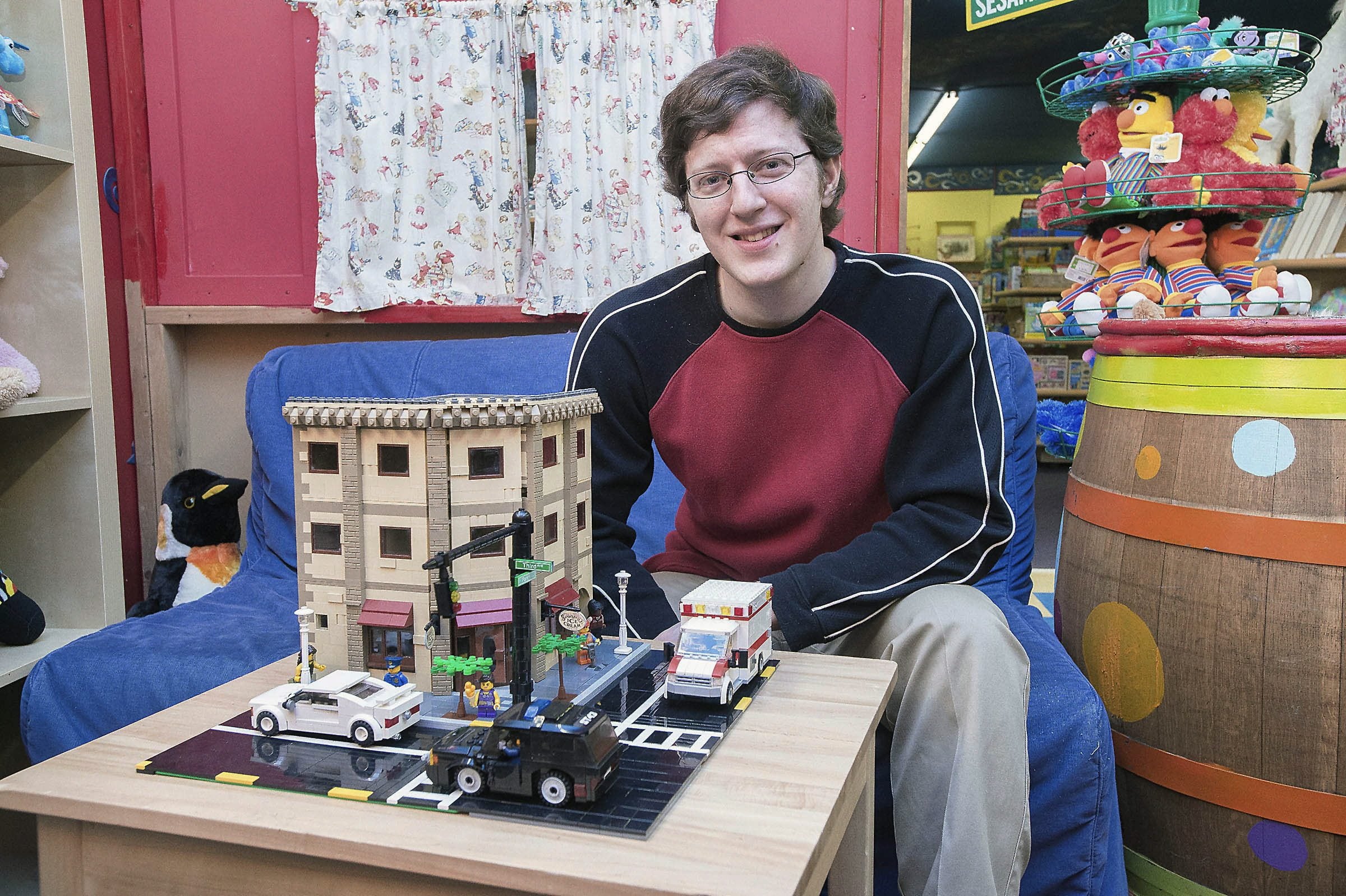 Kevin Wanner with his prize-winning Lego replica of the corner of Third and Evans streets in McMinnville, Ore.
