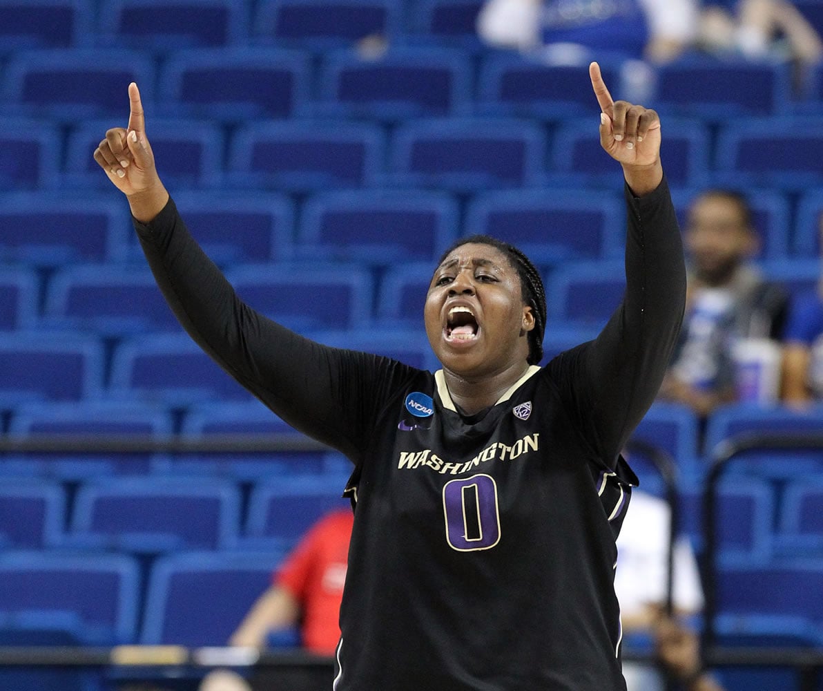 Washington's Chantel Osahor celebrates near the end of  a regional final women's college basketball game in the NCAA Tournament in Lexington, Ky., Sunday, March 27, 2016.