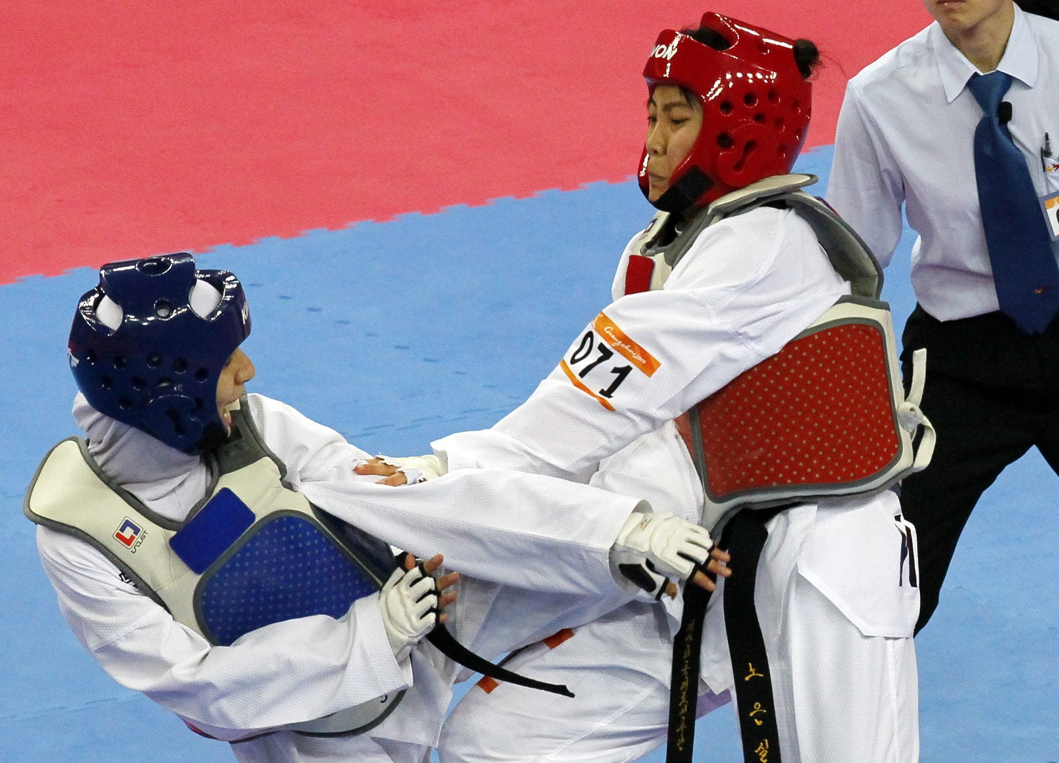 Raheleh Asemani of Iran, left, in action against  South Korea&#039;s Noh Eun-sil, during their women&#039;s under 62 Kg Taekwondo final at the 16th Asian Games in Guangzhou, China, in 2010.