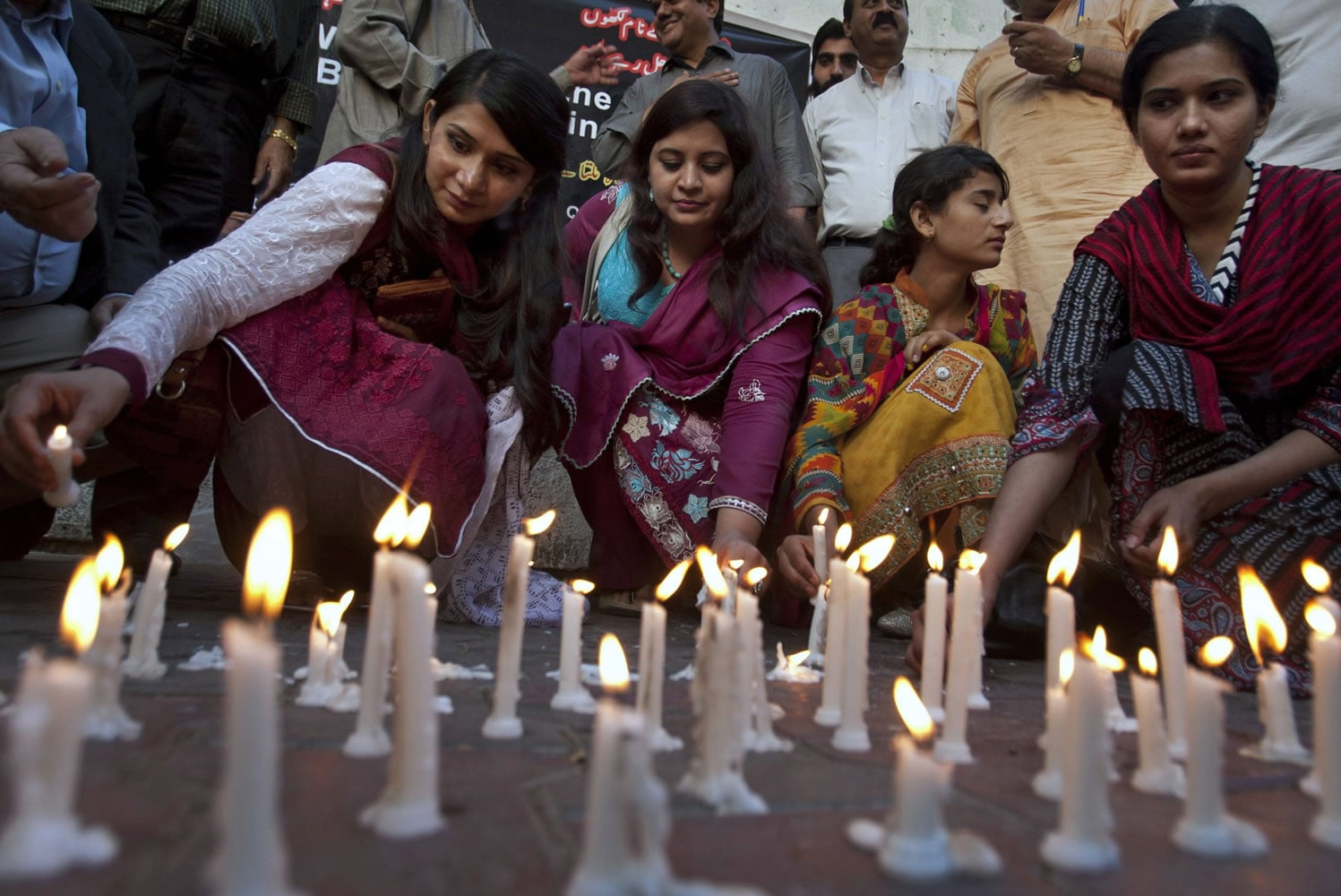 Members of a civil society group light candles Monday in Karachi, Pakistan during a vigil for the victims of Sunday&#039;s suicide bombing. Pakistan&#039;s prime minister vowed to eliminate perpetrators of terror attacks such as the massive suicide bombing that targeted Christians gathered for Easter the previous day in the eastern city of Lahore.