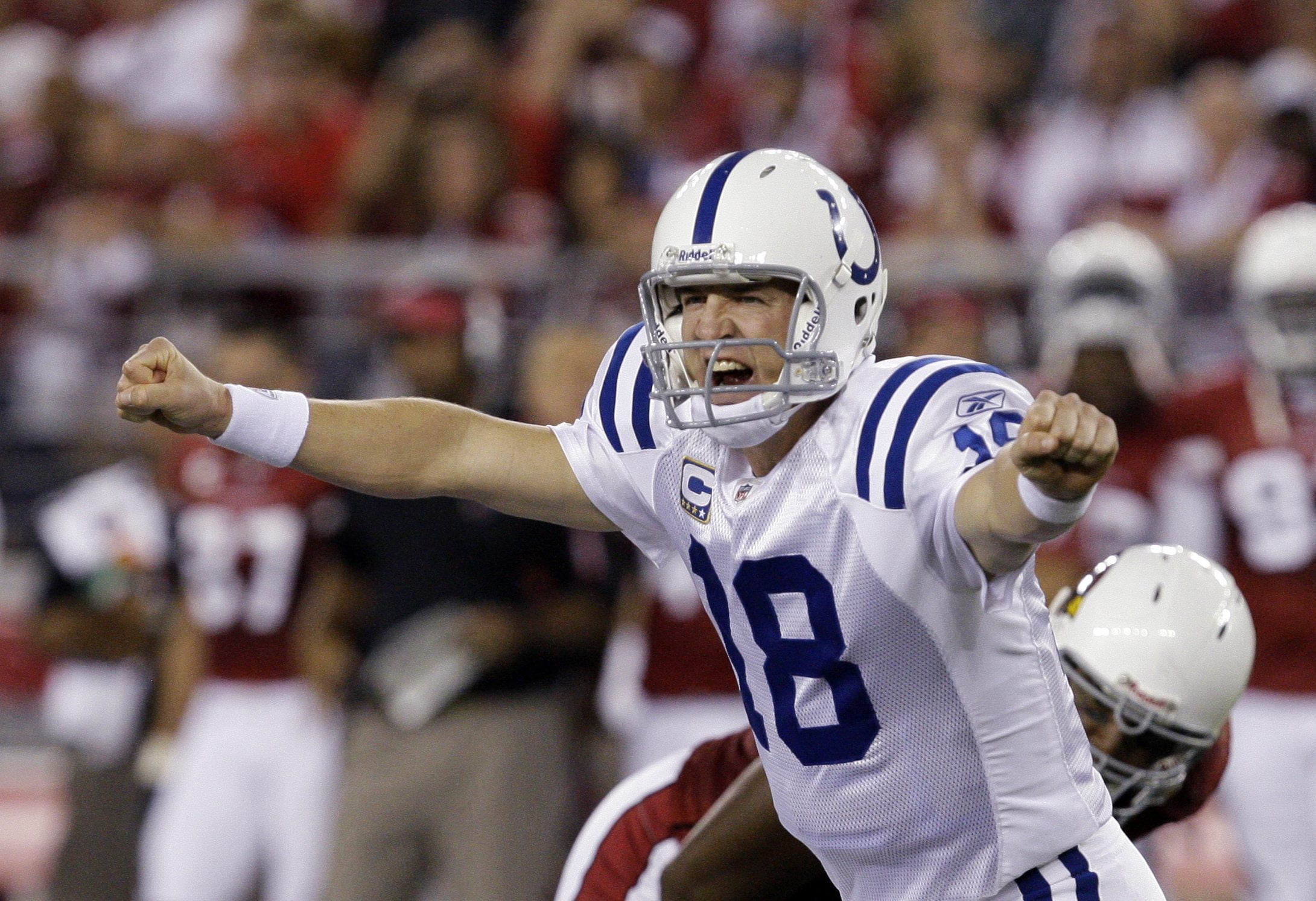 Indianapolis Colts' Peyton Manning shouts signals to teammates as they play the Arizona Cardinals in the second quarter of a football game in Glendale, Ariz. A person with knowledge of the decision tells The Associated Press on Sunday, March 6, 2016, that Manning has informed the Denver Broncos he's going to retire. (AP Photo/Ross D.